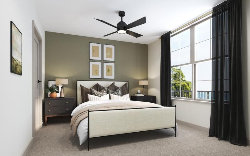 a bedroom with a large window