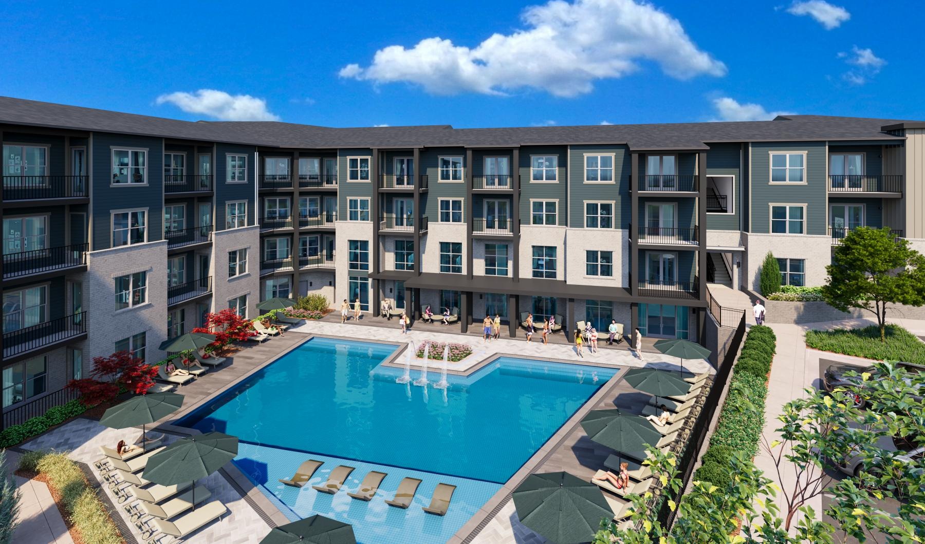 a large building with a pool in front of it