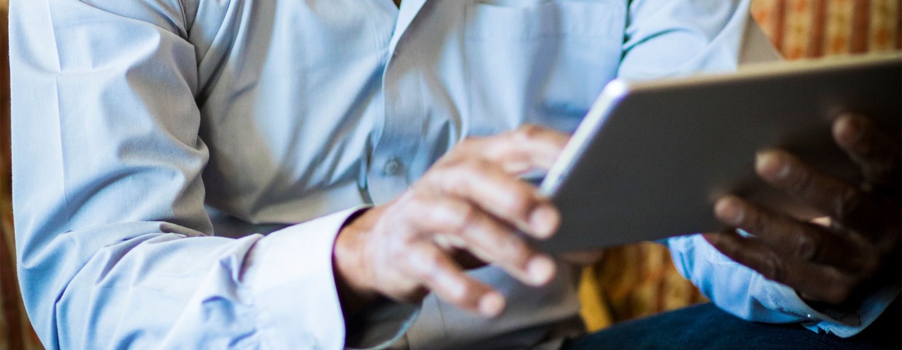 a man holding a tablet